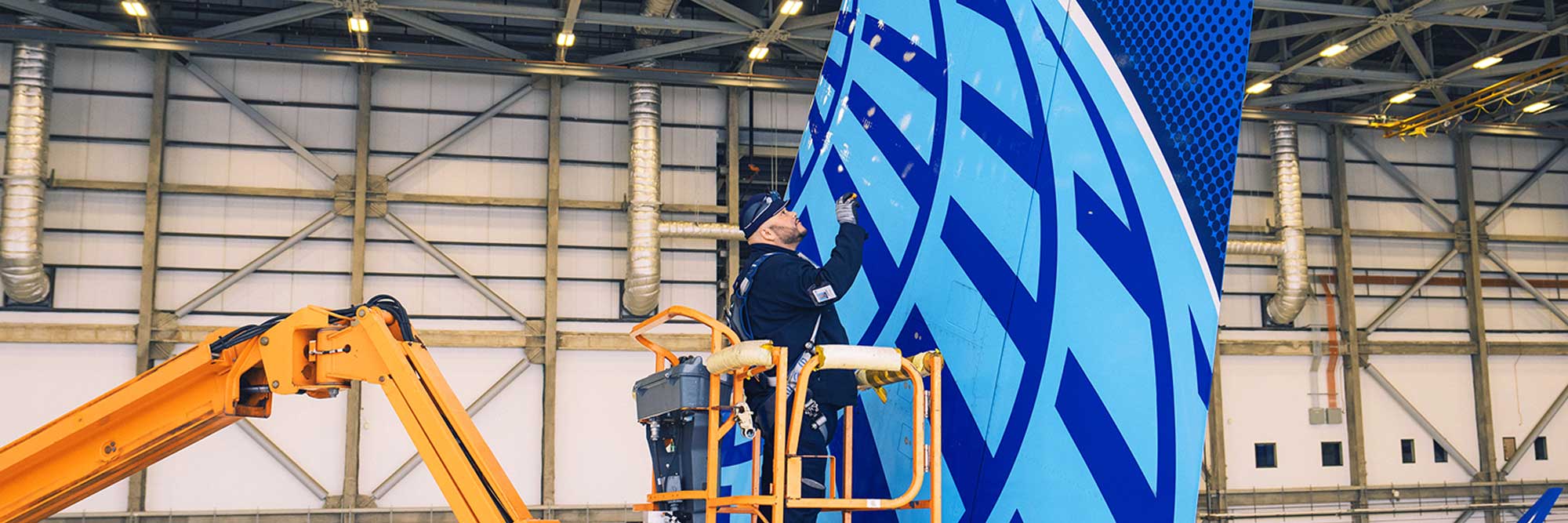 Service team working on an aircraft